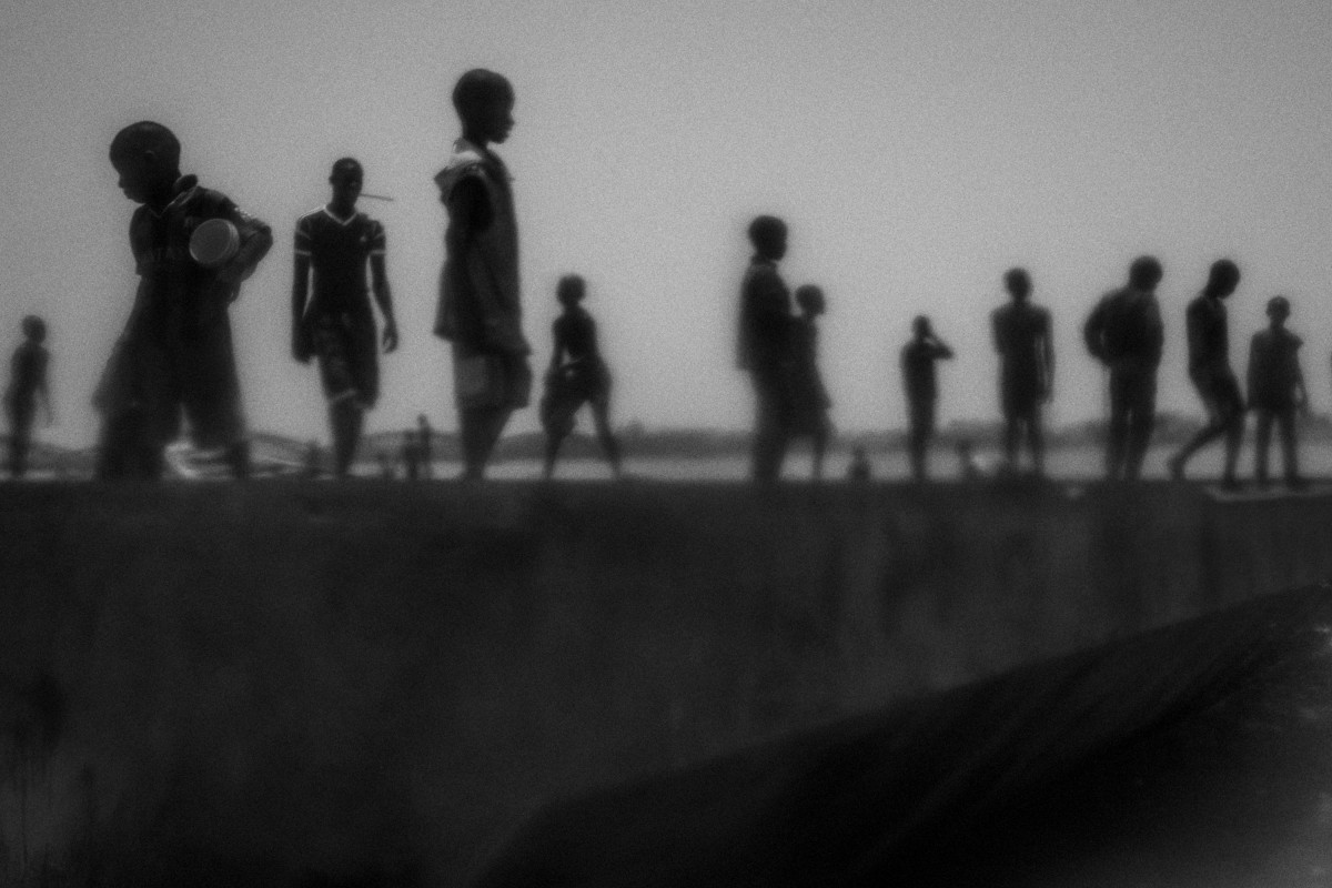 Runaway talibes stand on the bank of Senegal river, in Saint Louis city, north of Senegal, May 20, 2015. Saint Louis is known as Talibe city. A city with small proportions compared to Dakar but with a large number of Talibes. Due to that many of them choose the streets instead of Daaras.