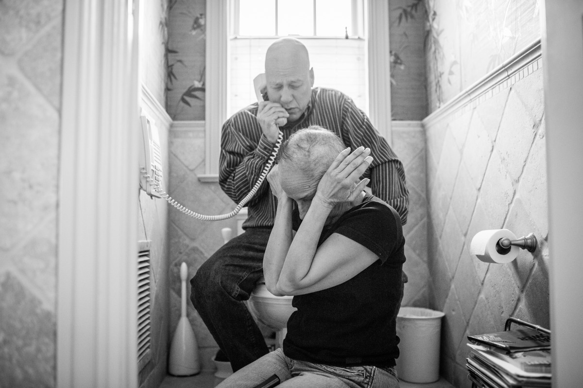 Howie and Laurel Borowick sit next to the bathroom telephone as they hear the most recent news from their oncologist- good scans for both of them, and their respective tumors are shrinking. What if one got good news and one got bad? Do they celebrate for themselves and mourn for the other?Chappaqua, New York. March 2013.