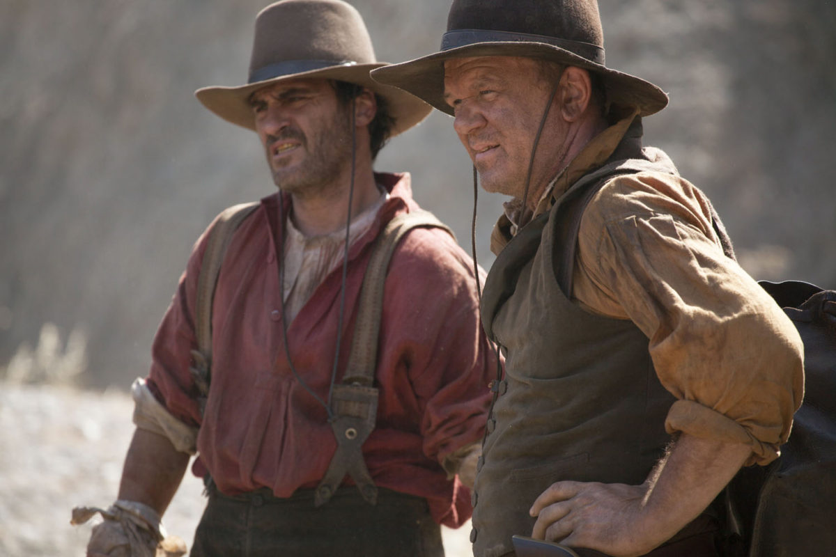 Joaquin Phoenix (left) stars as “Charlie Sisters” and John C. Reilly (right) stars as “Eli Sisters” in Jacques Audiard’s THE SISTERS BROTHERS, an Annapurna Pictures release. Credit : Magali Bragard / Annapurna Pictures